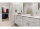 Bright bathroom with double vanity and walk in closet at 12425 Larue Ln, Huntersville, NC 28078