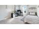 Bright bedroom with a single bed, a desk, and a window offering natural light at 12425 Larue Ln, Huntersville, NC 28078