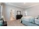 Bright bedroom featuring a tray ceiling, neutral tones and ensuite bathroom and walk-in closet at 12425 Larue Ln, Huntersville, NC 28078