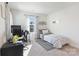 Cozy bedroom featuring a single bed and a functional desk area by the window at 12425 Larue Ln, Huntersville, NC 28078