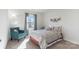 Cozy bedroom with natural light and a comfortable chair at 12425 Larue Ln, Huntersville, NC 28078
