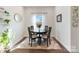 Cozy dining room with natural light, decorative rug, and stylish decor at 12425 Larue Ln, Huntersville, NC 28078