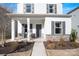 Charming two-story home showcasing stone accents, shutters, and inviting front porch at 12425 Larue Ln, Huntersville, NC 28078