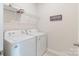 Laundry room featuring a washer, dryer and wire shelving at 12425 Larue Ln, Huntersville, NC 28078