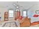 Neutral bedroom with carpeted floor, desk and shelves in a naturally lit room at 137 Mossy Pond Rd, Statesville, NC 28677