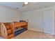 Bedroom featuring a wooden bunkbed, a window, carpeted flooring, and a ceiling fan at 137 Mossy Pond Rd, Statesville, NC 28677