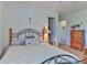 Bedroom featuring a full bed, carpeted floor, dresser, and hallway access at 137 Mossy Pond Rd, Statesville, NC 28677