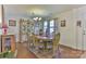 Traditional dining room with hardwood floors, elegant chandelier, and vintage furniture at 137 Mossy Pond Rd, Statesville, NC 28677