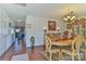 Open dining room with a view into the kitchen and beautiful hardwood floors at 137 Mossy Pond Rd, Statesville, NC 28677