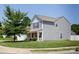 Well-maintained two-story home featuring a side-entry garage and manicured lawn at 137 Mossy Pond Rd, Statesville, NC 28677