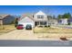 Charming two-story home with a well-manicured lawn and inviting front porch at 137 Mossy Pond Rd, Statesville, NC 28677