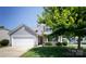 Inviting two-story home with a cozy front porch and lush green landscaping at 137 Mossy Pond Rd, Statesville, NC 28677
