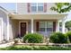 Inviting front porch featuring a decorative wreath and well-maintained landscaping at 137 Mossy Pond Rd, Statesville, NC 28677