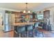 Kitchen featuring an island, stainless steel refrigerator, and dark wood cabinets at 137 Mossy Pond Rd, Statesville, NC 28677