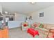 A carpeted living room features a sofa and armchair, with bright, neutral decor at 137 Mossy Pond Rd, Statesville, NC 28677