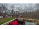 View of the backyard featuring a grill, a pavilion, an outbuilding, and dense trees at 14440 W Highway 55 Hwy, Blacksburg, SC 29702