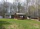 Backyard area with gazebo, shed, and animal pen surrounded by green grass at 14440 W Highway 55 Hwy, Blacksburg, SC 29702