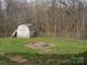 Backyard with a storage shed, firepit, and chain link fence at 14440 W Highway 55 Hwy, Blacksburg, SC 29702