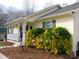Inviting single-story home featuring a charming porch and well-maintained landscaping at 14440 W Highway 55 Hwy, Blacksburg, SC 29702