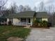 Charming home with a cozy front porch and mature landscaping creating curb appeal at 14440 W Highway 55 Hwy, Blacksburg, SC 29702