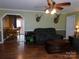 Cozy living room with a view into the dining area, featuring hardwood floors at 14440 W Highway 55 Hwy, Blacksburg, SC 29702