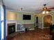 Spacious living room with wood floors, fireplace, and open floor plan at 14440 W Highway 55 Hwy, Blacksburg, SC 29702