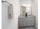 Bathroom with double vanity, granite countertop, and updated fixtures at 1505 W May Ave, Gastonia, NC 28052