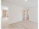 Neutral bedroom featuring two entryways and light wood-look flooring and natural light at 164 S Sycamore St, Mooresville, NC 28115