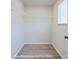 Spacious walk-in closet with modern white wire shelving and a window for natural light at 164 S Sycamore St, Mooresville, NC 28115