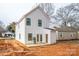 This home features a bright white exterior, a rear patio and unfinished backyard space, presenting a great opportunity to customize at 164 S Sycamore St, Mooresville, NC 28115