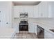 Bright kitchen featuring stainless steel appliances and white cabinets at 164 S Sycamore St, Mooresville, NC 28115