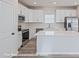 Kitchen with stainless steel appliances and white cabinets at 164 S Sycamore St, Mooresville, NC 28115