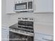 New stainless steel oven cooktop and white countertops at 164 S Sycamore St, Mooresville, NC 28115