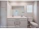 Bright bathroom featuring a double sink vanity and large mirror at 166 S Sycamore St, Mooresville, NC 28115