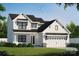New two-story home boasts white siding, black trim, and an attached two-car garage at 1906 Maius Dr, Conover, NC 28613