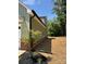 Side exterior features green siding, brick foundation, and manicured landscaping, showcasing the home's structure at 1906 Maius Dr, Conover, NC 28613