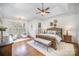 Large main bedroom with hardwood floors, ceiling fan and lots of natural light at 2028 Fitzhugh Ln, Weddington, NC 28104