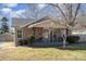 Charming bungalow featuring a covered porch with decorative ironwork and a well-maintained front yard at 205 S Pine St, Dallas, NC 28034