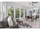 Sunlit breakfast nook with large windows, a cozy seating area, and a view of the backyard at 226 Fairview Ln, Davidson, NC 28036