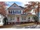 Charming two-story home with a covered front porch and mature trees in a desirable neighborhood at 226 Fairview Ln, Davidson, NC 28036