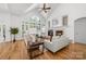 Spacious living room with vaulted ceiling, large windows, fireplace, and hardwood floors at 226 Fairview Ln, Davidson, NC 28036