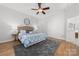 Comfortable main bedroom featuring neutral tones, a ceiling fan, and elegant furnishings at 226 Fairview Ln, Davidson, NC 28036
