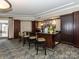 Resident's bar area with modern seating and an open view of the exterior through the entry door at 300 W 5Th W St # 407, Charlotte, NC 28202