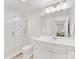 Bright bathroom features a walk-in shower, and white vanity with ample storage space at 300 W 5Th W St # 407, Charlotte, NC 28202