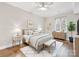 Well-lit bedroom with wood floors, neutral walls, and a large window at 300 W 5Th W St # 407, Charlotte, NC 28202