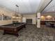 Spacious billiards room featuring a pool table, seating area, and stylish lighting at 300 W 5Th W St # 407, Charlotte, NC 28202