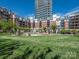 Beautiful courtyard featuring a well-manicured lawn, fountain, and views of the surrounding condominium buildings at 300 W 5Th W St # 407, Charlotte, NC 28202