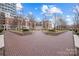 Beautiful courtyard featuring brick pavers, landscaping, and views of the surrounding condominium buildings at 300 W 5Th W St # 407, Charlotte, NC 28202