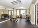 Bright fitness center with free weights, machines, and mirrors for a comprehensive workout at 300 W 5Th W St # 407, Charlotte, NC 28202