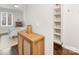 Hallway displaying wood cabinet with bedroom view, enhancing the home's interior design at 300 W 5Th W St # 407, Charlotte, NC 28202